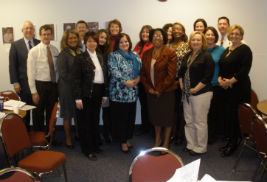 The 2012 Administrator class of the Institute for Excellence get together for a photo with Kent State President Lester A. Lefton (far left).