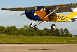 The 5X Flight Team's plane lands at the 5X Airport. The flight team qualified to compete in the National NIFA SAFECON competition in May 2014.