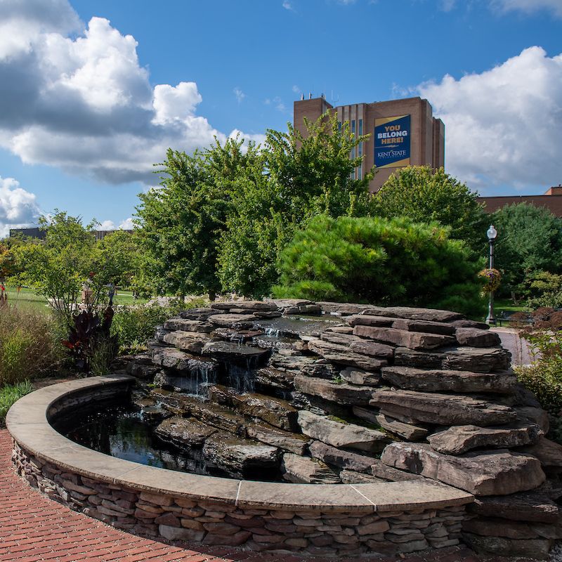The Student Memorial Garden with the Kent State library in the background.