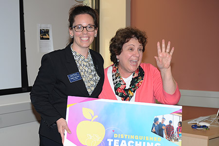 Associate Professor Jan Leach (right) reacts after learning she is a 2016 recipient of a Distinguished Teaching Award.