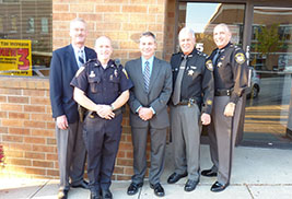 Pictured from left to right are Mental Health and Recovery Board Chairman William Nome, Kent State Police Officer Will Scritchfield, who is a 2013 CIT Officer of the Year, Kent State Assistant Police Chief Dean Tondiglia, Major Dennis Missimi of the Portage County Sheriff's Office and Portage County Sheriff David Doak.