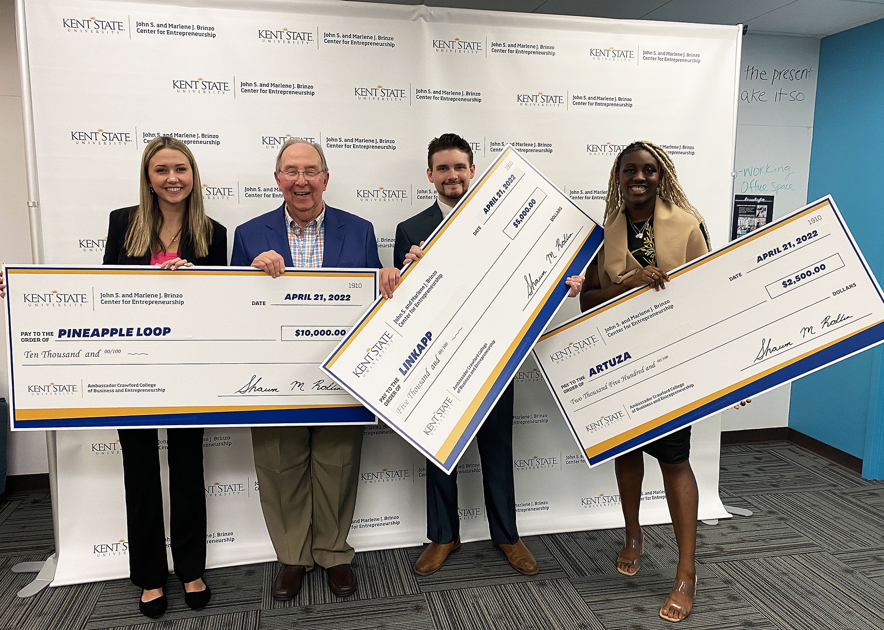 2022 CEBI Pitch winners posing with winning checks