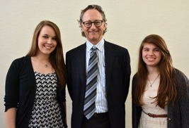 Essay winners Kaitlynn LeBeau from ɫֱ’s School of Journalism and Mass Communication (left) and Anna Hoffman from ɫֱ’s School of Communication Studies (right) are congratulated by Larry Armstrong, who represented the Prague Freedom Foundation.