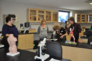 Students are proud to show off the new biology lab to visitors. Students are proud to show off the new biology lab to visitors.