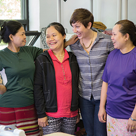 Tessa Reeves with the employees of Neighbors Apparel photographed by Melissa Olson