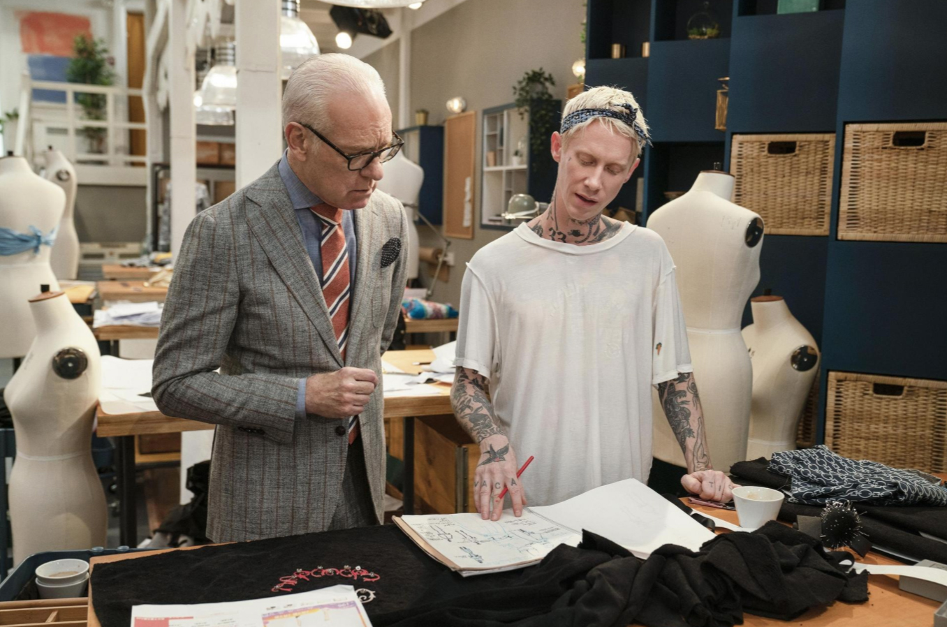 Design mentor, Tim Gunn, left, gives advice to Joshua Hupper, a Hillard, OH native and MŮ alumnus, about his designs on the reality tv show, "Making the Cut," which will premier Friday, March 27 [Amazon Studios] [Originally posted: The Columbus Di