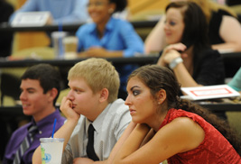 High school students listen to business plan presentations by their colleagues participating in the Young Business Scholars Program at ɫֱ