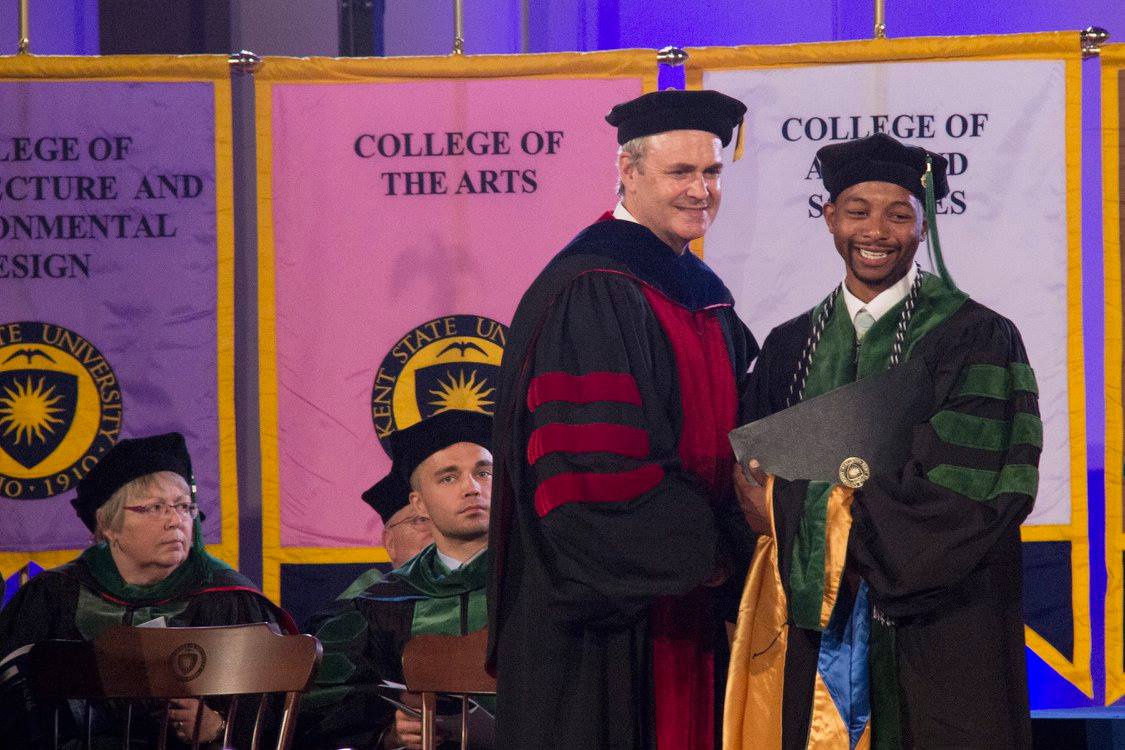 Josh Wilder receiving his diploma