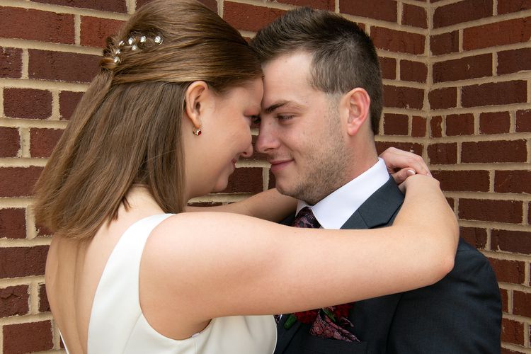 bride and groom embrace