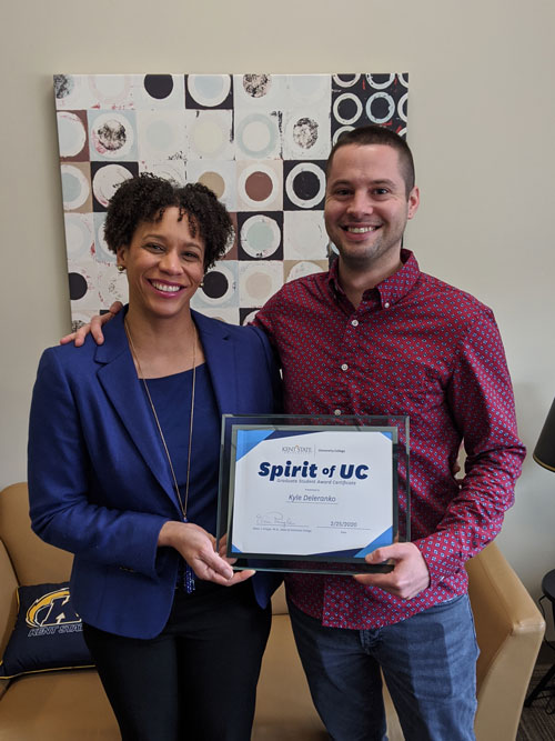 Kyle Delarenko, winner of the Spirit of UC Award for Graduate Students, with Dean Eboni Pringle