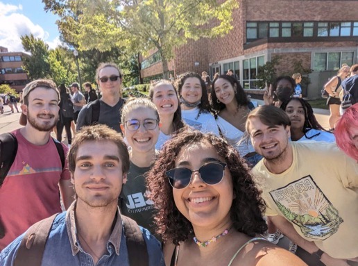 Leah taking a selfie with a group