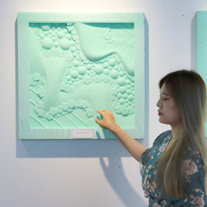 A woman testing out a milled panel