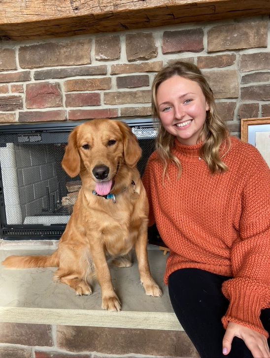 image of Rebecca Cybulski and golden dog
