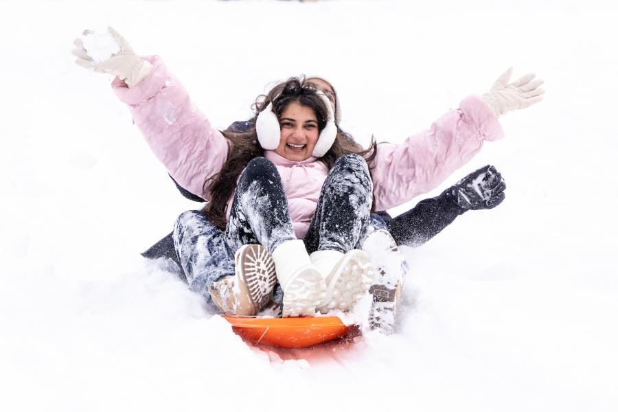 Students sled ride during major snow storm on Jan. 26, 2026