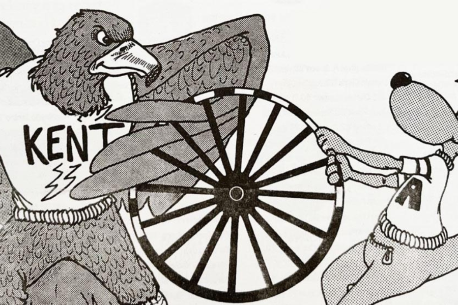 A cartoon drawing of the Kent mascot Flash and the Akron mascot Zip fighting over the wagon wheel.