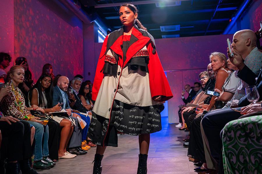 A model showcases a design by a ������ fashion design student during a 2023 fashion show in New York City. (Photo credit: Rami Daud, ������)