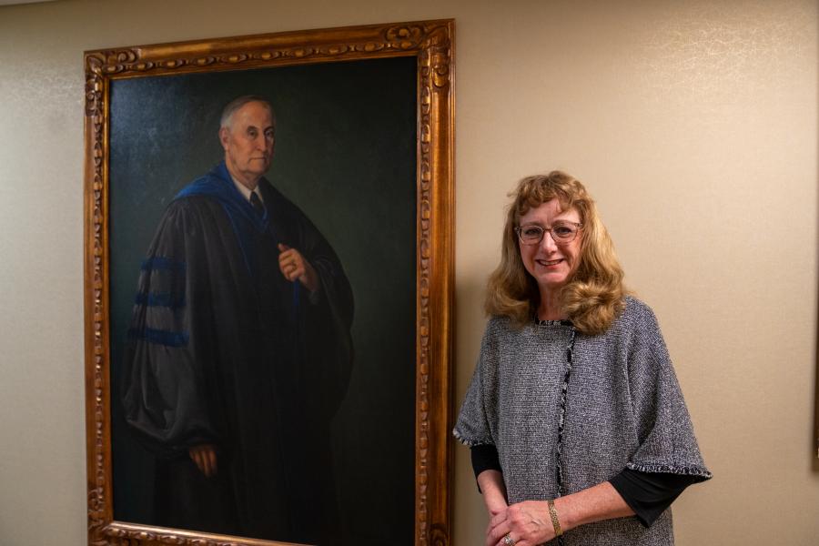 Ellen Engleman Conners, poses near the portrait of her great-grandfather, 糖心Vlog's third president, James Engleman. Ellen Engleman Conners, poses near the portrait of her great-grandfather, 糖心Vlog's third president, James Engleman.