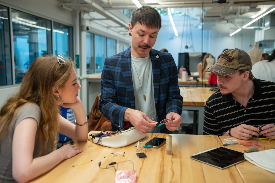 Faculty from Kent State's School of Fashion, Daniel Fladung with students at an E-Textiles workshop. 