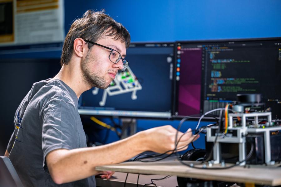 Student working in the Digital Engineering Design Center using the digital tools to help design and build a prototype.