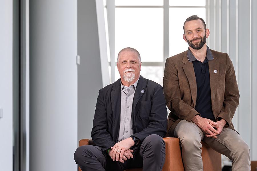 Chris Cooper and Mike Palmieri of the OEOC pose for a photo in Kent State's Crawford Hall