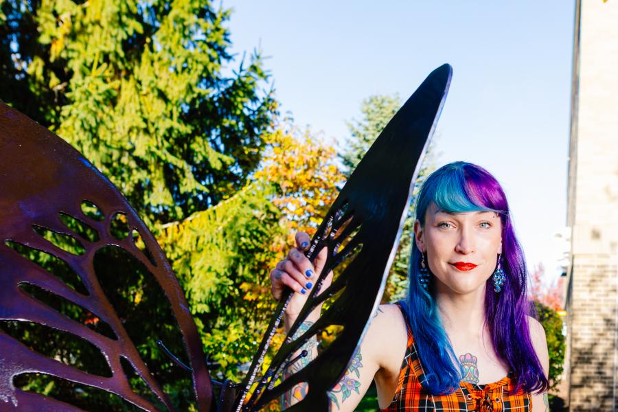 Butterfly sculpture with artist