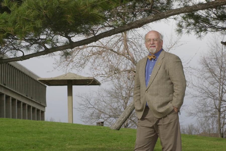 Jerry M Lewis standing in front of the May 4th site