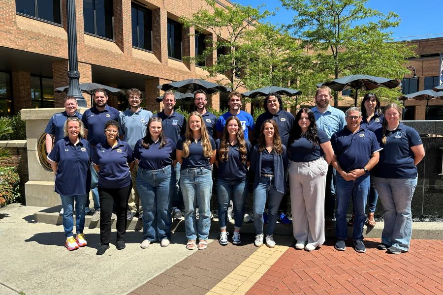 51 admissions counselors stand in front of Risman Fountain.