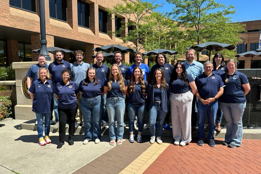 Kent State admissions counselors stand in front of Risman Fountain.
