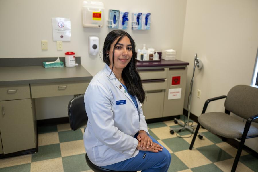 Ayat Husain, a student at Kent State University's College of Podiatric Medicine, sits in one of the college's clinic rooms. (Photo credit: Bob Christy)