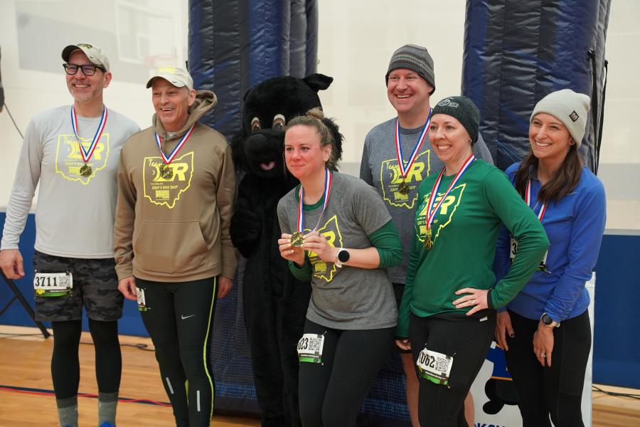 Group photo with black squirrel with medals