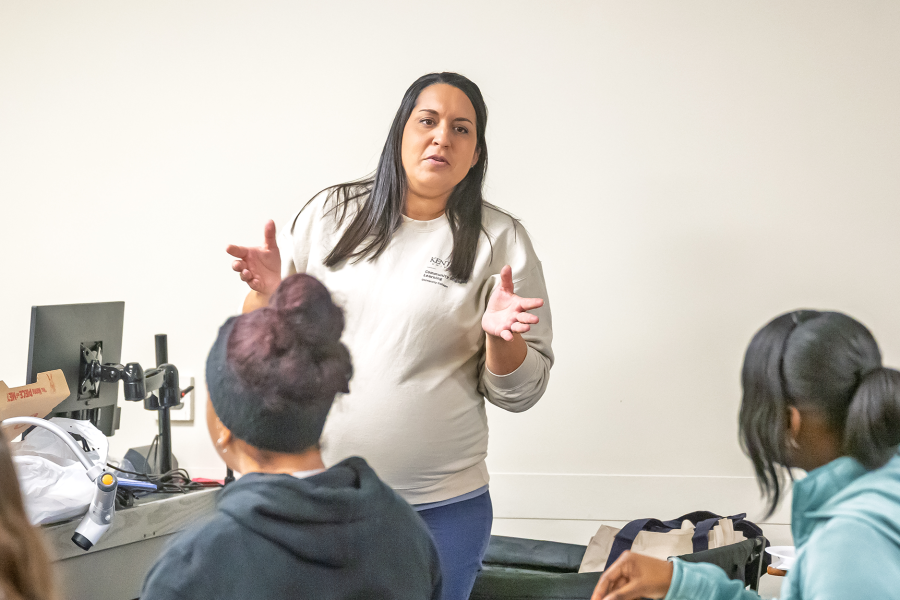 Brianna Benson talks to students.