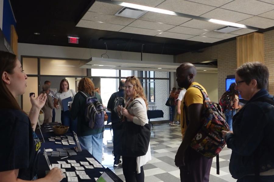 Teachers mingling in lobby of Franklin Hall for CTE Day