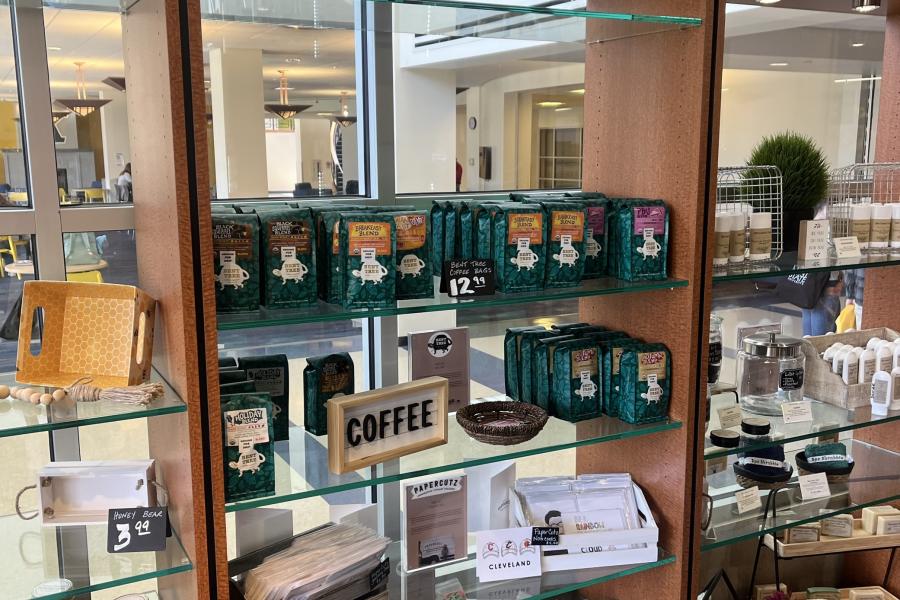 Community Corner display case shelves holding various market items for sale