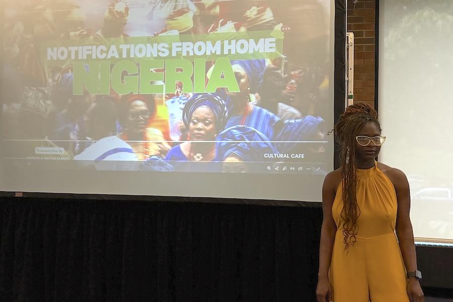 Graduate student Abisola Mohammed speaking at Cultural Cafe.