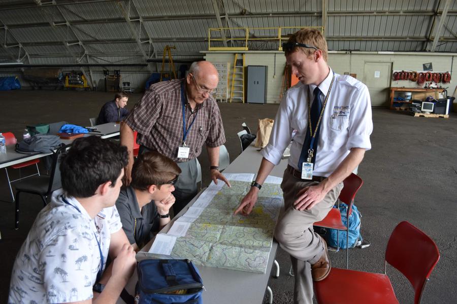 Captain Maurer working alongside Brian Neff to educate and mentor young students interested in aviation careers.