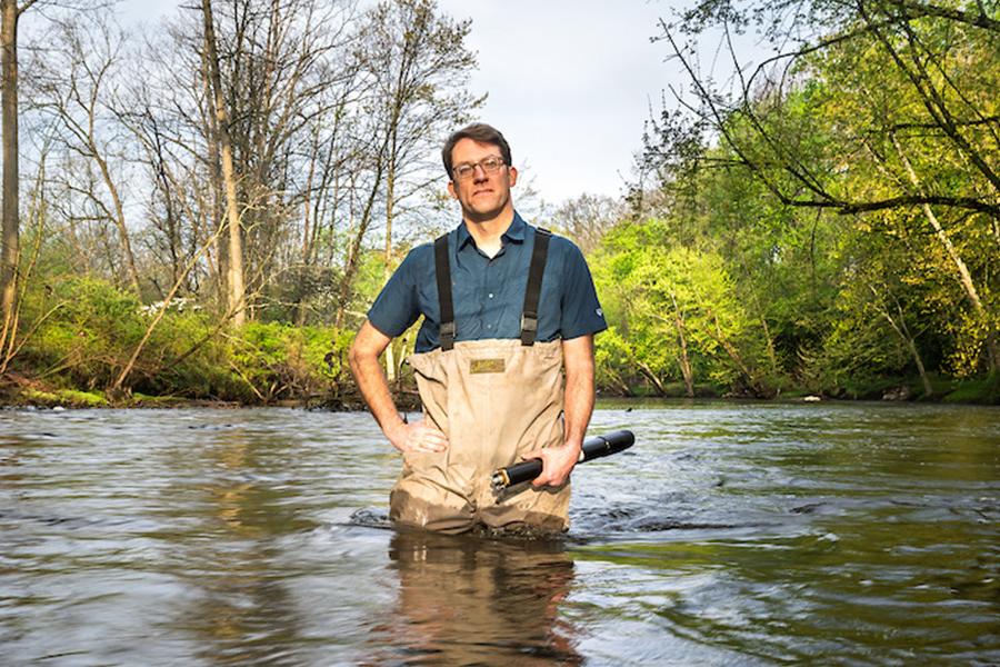 David Costello, Ph.D., professor of biological sciences at �Ը������� University, conducts research in the Cuyahoga River. (Photo credit: Rami Daud)