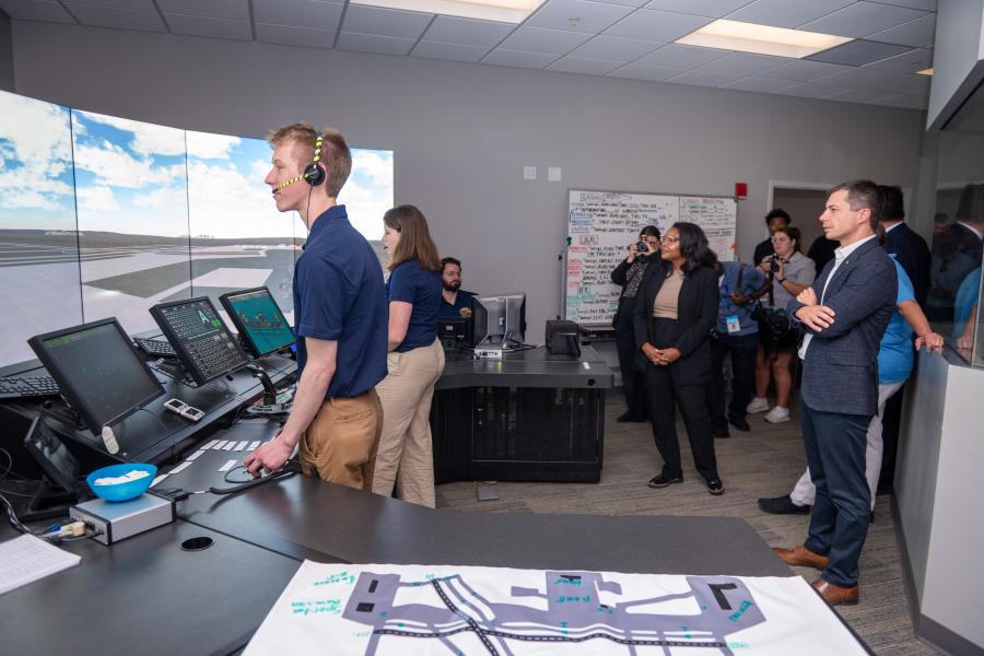 Jackson in the air traffic control lab with Pete Buttigieg