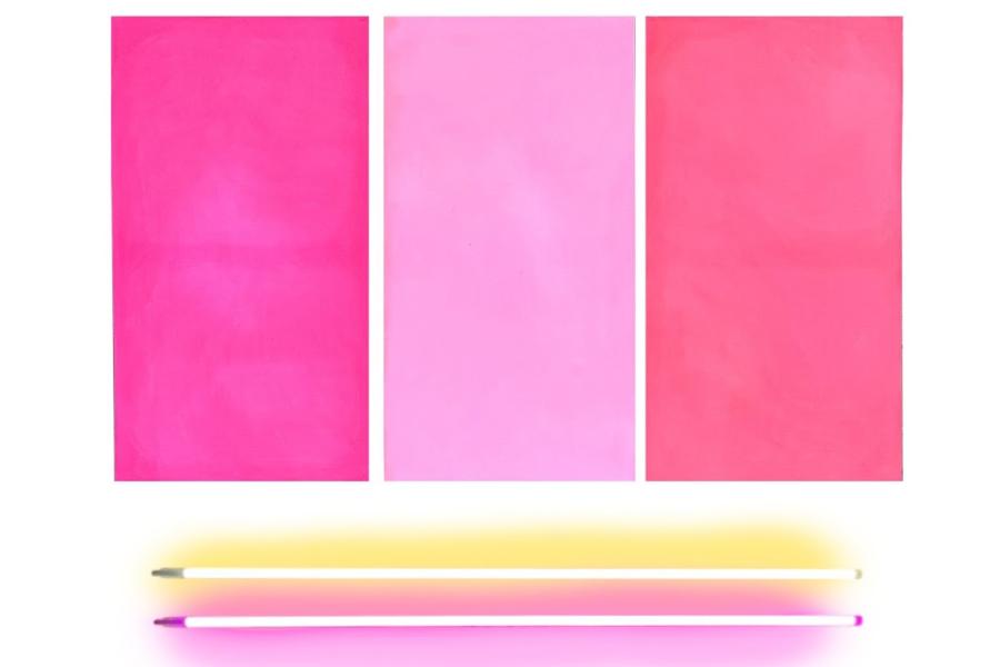 A vibrant painting with textured pink rectangles and two bars of neon lights set below it. 