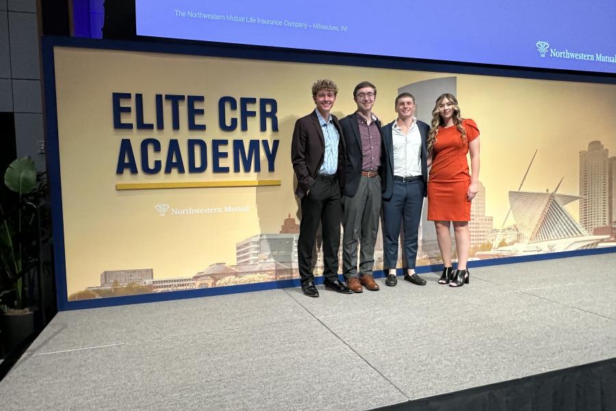 Josh Bordonaro on stage with fellow interns