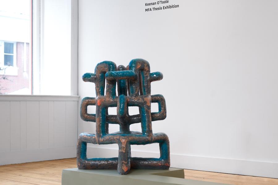 a large geometric sculpture intersects with its self.