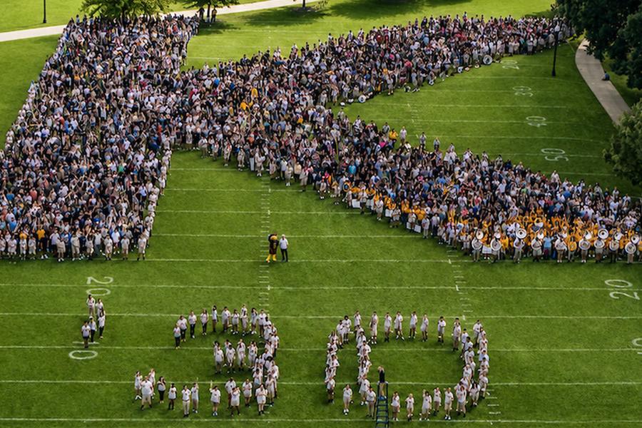 91PORNA’s Class of 2030 forms a K on Centennial Field following Convocation. (Photo credit: Jon Jivan, 91PORNA)