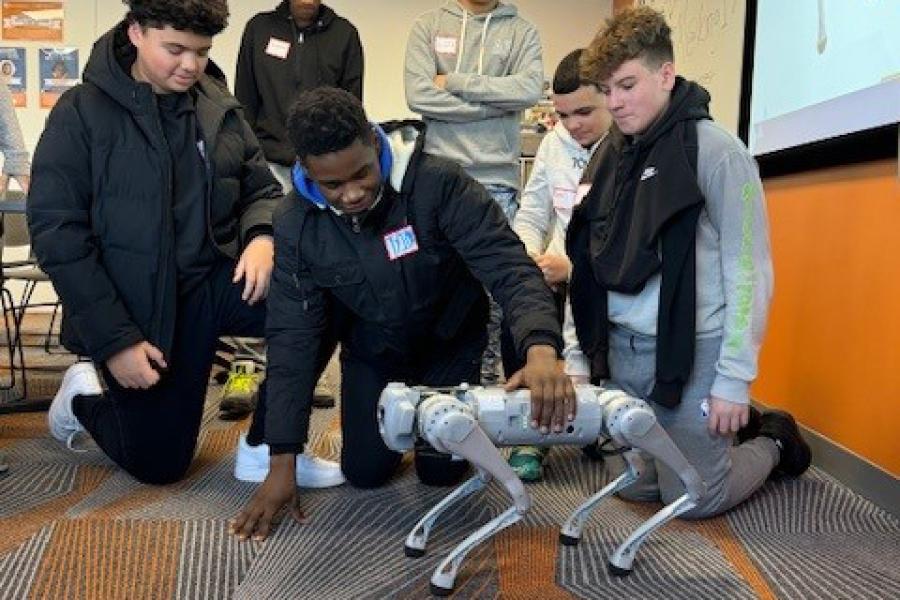 Students at MAGNET use a robot dog
