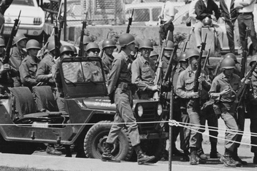 National Guard personnel walk with weapons and jeeps in a line on May 4, 1970, at ��������. (Photo credit: News Service May 4 photographs, �������� Libraries, Special Collections and Archives)