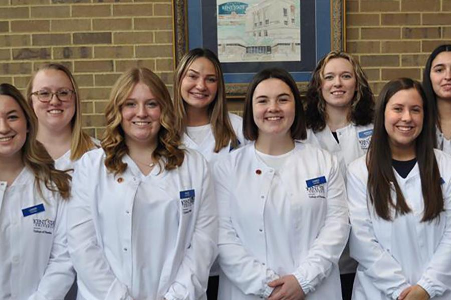 Receiving their white coats were (front, from left) Landry Baker, Paige Grimes, Cameo Hurst, Ella Carano, Alexis Vlaiku, and (back from left) Mackenzie Parker, Mikayla Busse, Destiny Grey, Morgan Lucas, Angelina Lopez.