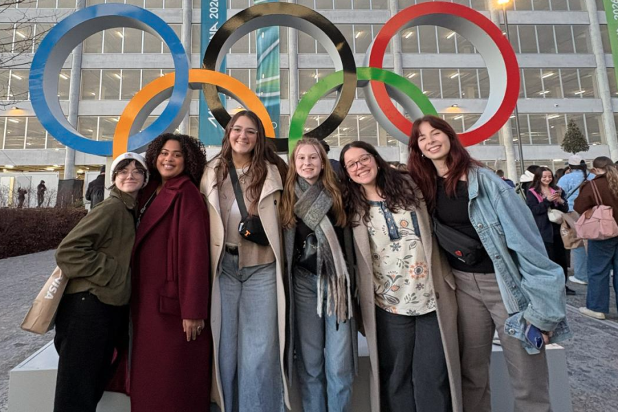 Alex Newnes and friends in front of the Olympic Rings.