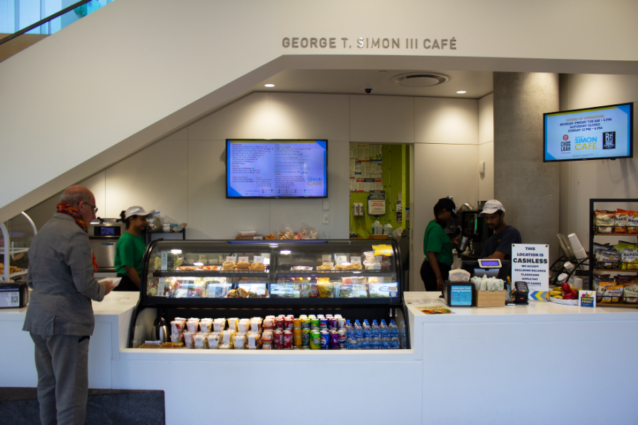 Front view of the Simon Café under the Architecture and Environmental Design building's grand staircase