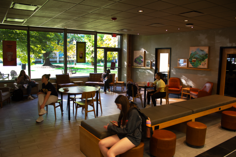 View of the seating area within the Starbucks Library, with students lounging in some of the available seating