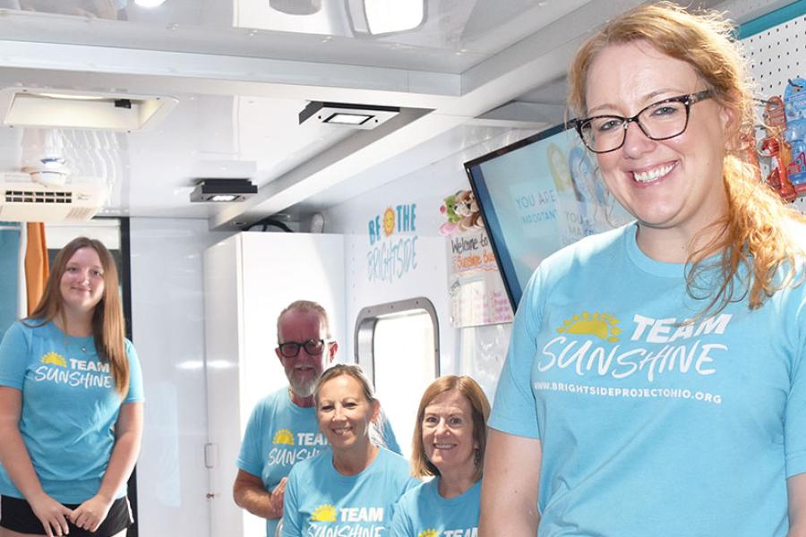 Team Sunshine at a stop in East Liverpool included (from left) volunteers Calvin Marshall and Addison Wallace (Lisa’s daughter); Scott Lewis (co-founder, executive director and Lisa’s dad); volunteers Diane Detell and Donna Vollnogle; and Lisa Vittorio.