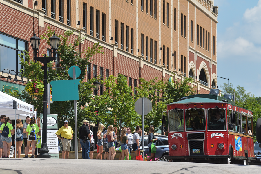 A trolley bus comes through bustling downtown Kent. 