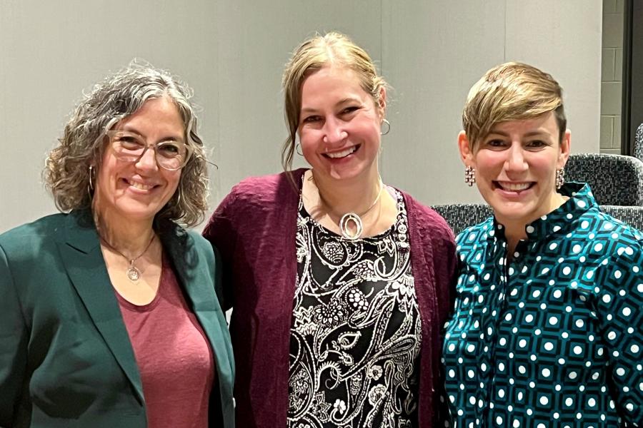 Dr. Tara Smith (center), Dr. Jennifer Reich (left), and Nadine Gartner (right) discuss vaccine hesitancy and response in 2023